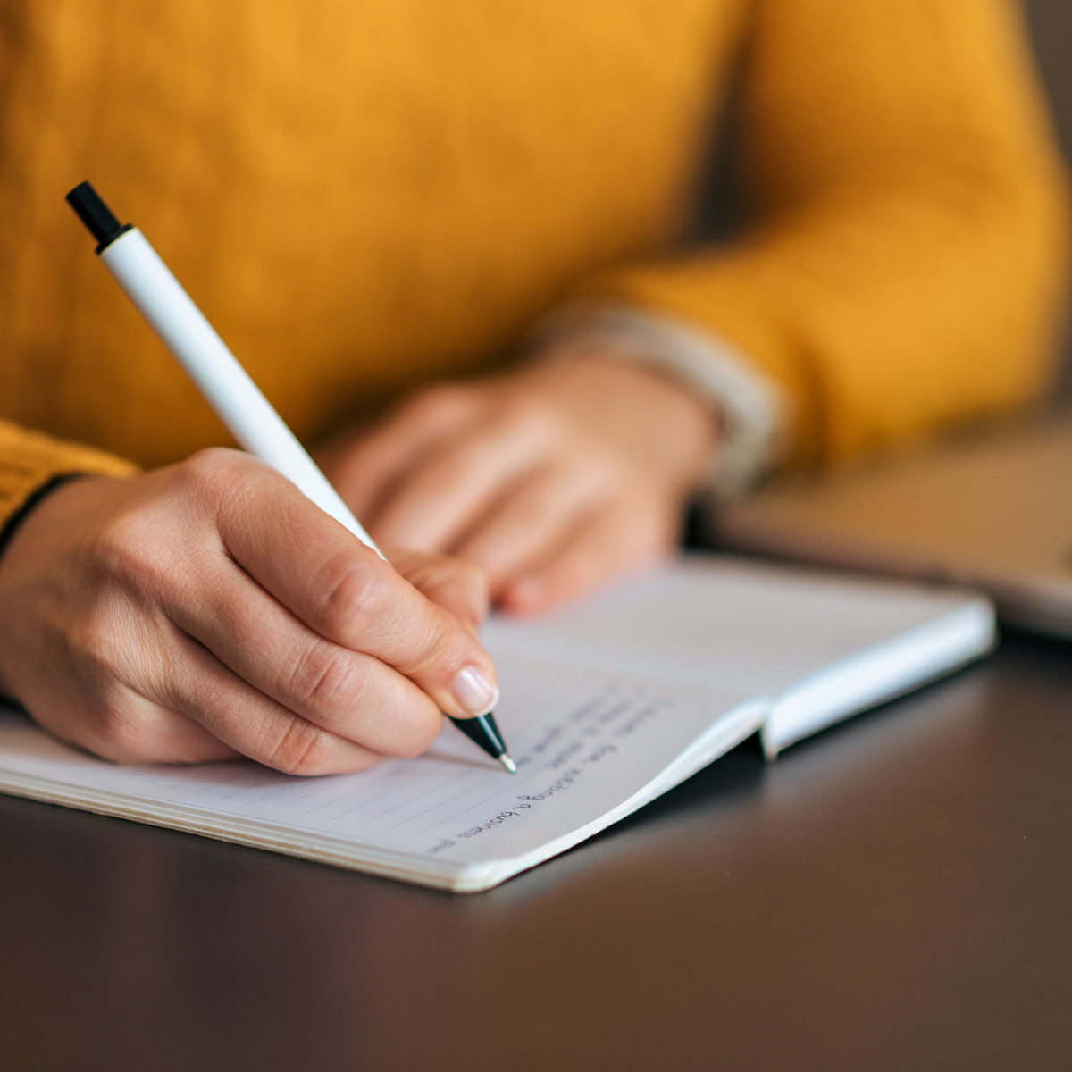photo of woman writing